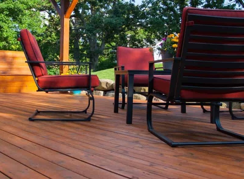 Beautifully finished outdoor wood deck with patio furniture