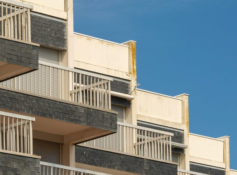 Central Missouri multi-family apartment complex exterior with stacked balconies
